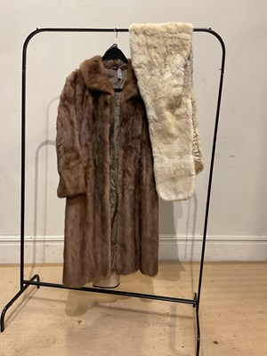 Lot 2015 - SOVEREIGN FURS; a full length light brown mink...