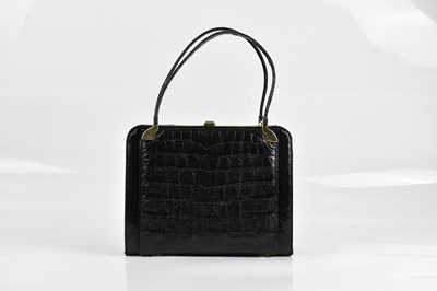 Lot 2057 - ESTEVE; a vintage black crocodile skin handbag,...