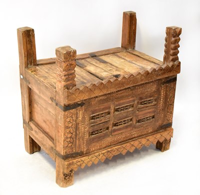 Lot 262 - An Indian wooden carved Damchiya or dowry...
