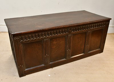 Lot 2260 - An 18th century oak coffer with carved and...