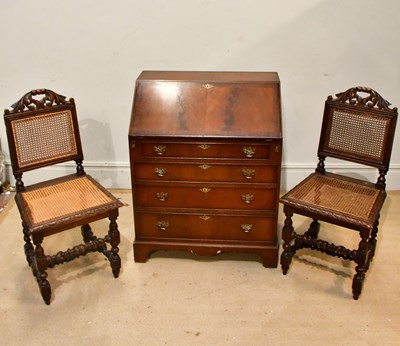 Lot 2467 - REPRODUX; a reproduction mahogany bureau, the...