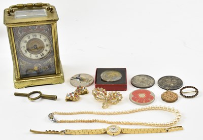 Lot 939 - A brass cased carriage clock, the white enamel...