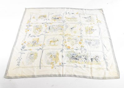 Lot 1903 - HERMÈS; a 100% silk cream, light blue and gold...