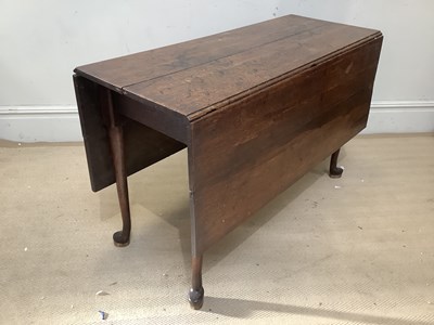 Lot 2296 - A Georgian oak rectangular drop-leaf dining...