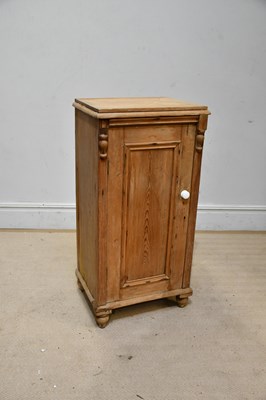 Lot 2435 - An old pine cupboard with single panel door,...