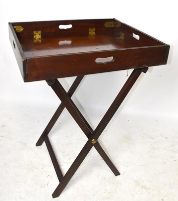 Lot 1562 - An early 19th century mahogany butler's tray on folding stand