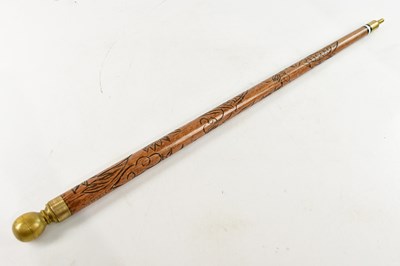 Lot 2562 - A modern carved walking stick/ snooker cue,...
