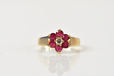 Lot 1498 - A 9ct yellow gold daisy dress ring set with a...
