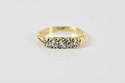 Lot 1428 - An 18ct yellow gold and graduated five stone...