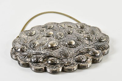 Lot 86 - A shaped oval mirror with bud and leaf...
