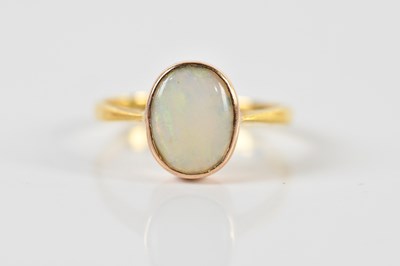 Lot 1429 - A 22ct yellow gold opal set ring, size K 1/2,...