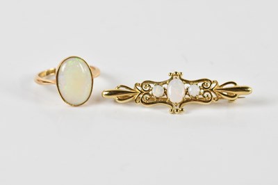 Lot 1430 - An 18ct yellow gold and opal ring, size J 1/2,...