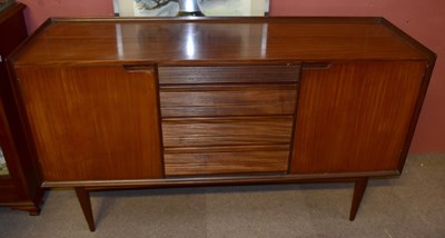 Lot 1572 - A teak sideboard