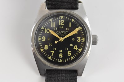 Lot 1879 - US NAVY; a manual wind wristwatch, the black...