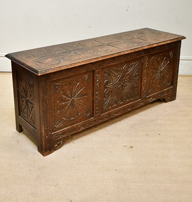 Lot 2261 - An 18th century oak carved three panel coffer,...