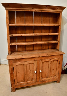 Lot 2253 - An old pine dresser with two cupboard doors...