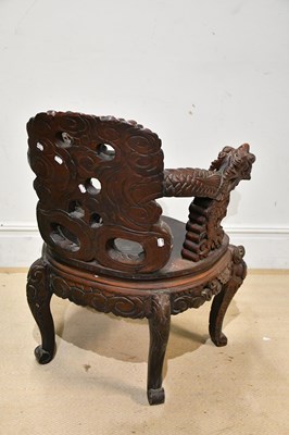 Lot 2447 - A Chinese carved rosewood elbow chair, carved...
