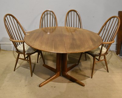 Lot 2204 - ERCOL; an extending teak dining table, with...