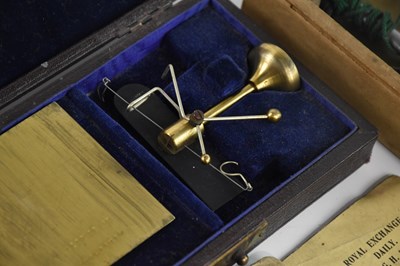 Lot 2563 - A set of cased jewellery scales, with a cased...