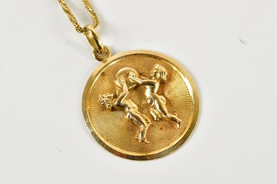 Lot 1612 - A 9ct yellow gold circular pendant with simple...