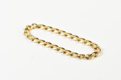 Lot 1548 - A yellow metal curb link bracelet, unmarked,...
