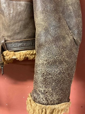 Lot 86 - A vintage sheepskin flying jacket. Proceeds to...