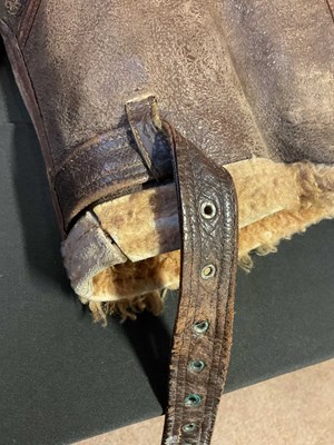 Lot 86 - A vintage sheepskin flying jacket. Proceeds to...