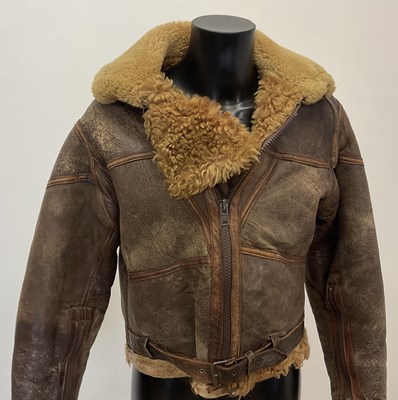 Lot 86 - A vintage sheepskin flying jacket. Proceeds to...
