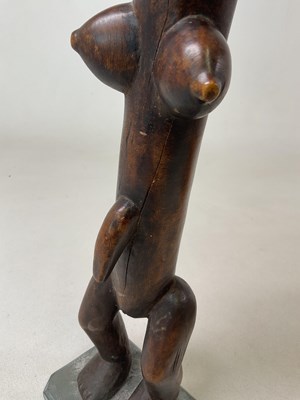 Lot 80 - A 20th century carved African tribal figure of...