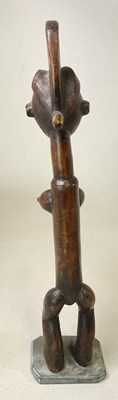 Lot 80 - A 20th century carved African tribal figure of...