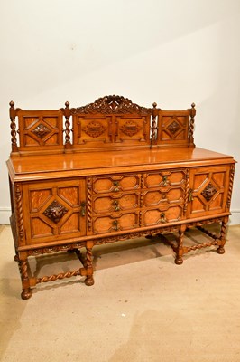Lot 2312 - An early 20th century carved oak sideboard,...
