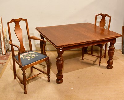 Lot 2313 - An early 20th century draw-leaf dining table...