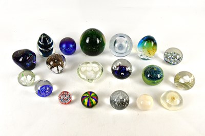 Lot 2835 - A collection of nineteen glass paperweights...