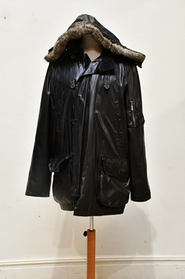 Lot 1977 - BARBOUR; a black gentleman's short raincoat,...