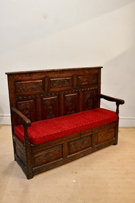 Lot 2234 - An 18th century and later carved oak settle,...