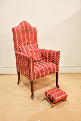 Lot 2438 - An early 20th century oak framed elbow chair...