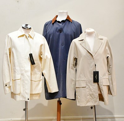 Lot 751 - HARRODS; a full length blue lady's trench coat,...