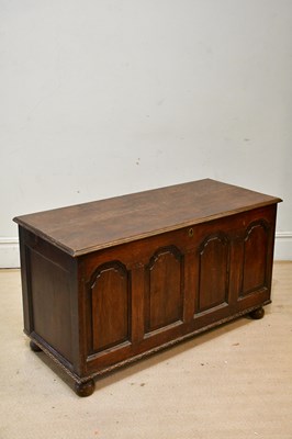 Lot 2280 - An oak coffer, with hinged lid above panelled...