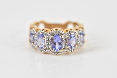Lot 1495 - A 14ct yellow gold five stone graduated...