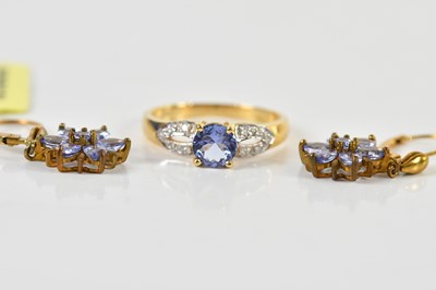 Lot 1487 - An 18ct yellow gold tanzanite dress ring, size...