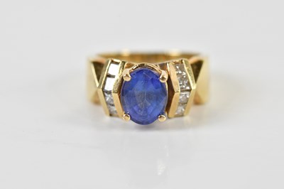 Lot 1425 - A 14ct tanzanite dress ring, the oval four...