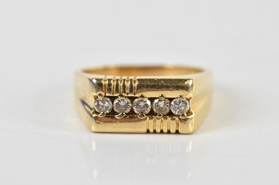 Lot 1426 - A 14ct yellow gold five stone diamond channel...