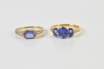 Lot 1398 - An 18ct yellow gold tanzanite graduated three...