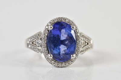 Lot 1302 - A platinum, tanzanite and diamond ring, the...