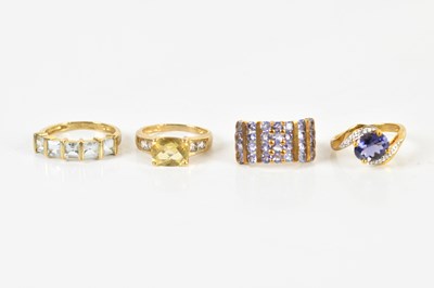 Lot 1405 - Four 9ct yellow gold dress rings, combined...