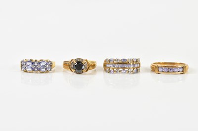 Lot 1411 - Four 9ct yellow gold dress rings including one...