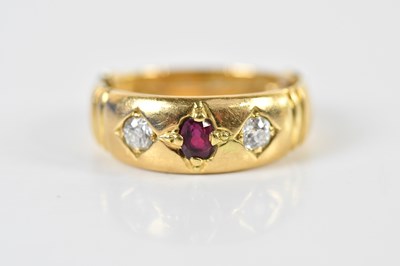 Lot 1413 - An 18ct yellow gold ruby and diamond three...