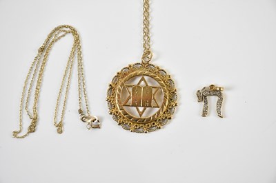 Lot 349 - A 9ct yellow gold Star of David pierced...