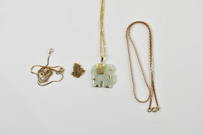 Lot 1632 - A 9ct yellow gold chain suspending a carved...