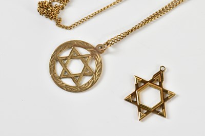 Lot 384 - Two 9ct yellow gold Star of David pendants and...